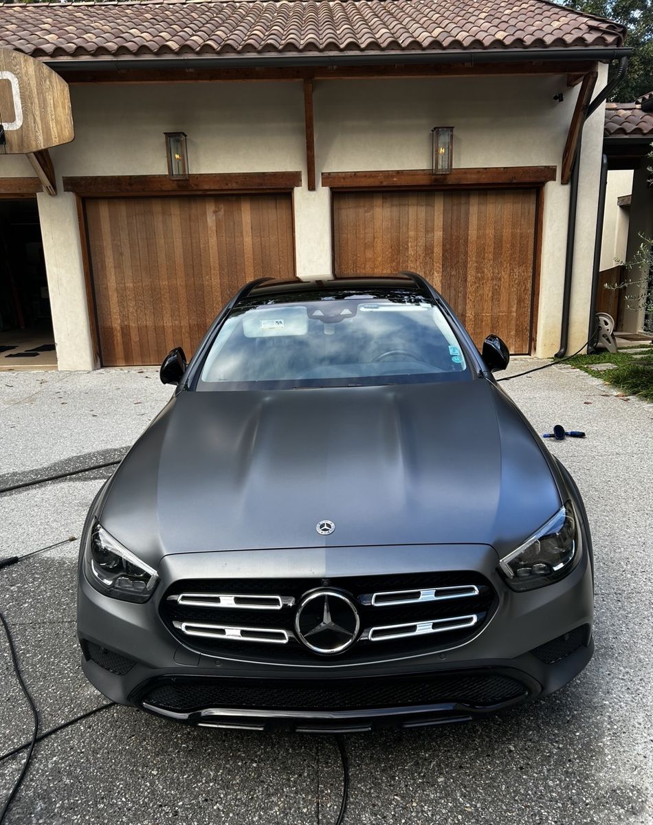 Matte grey Mercedes E-Class wagon detailed on a driveway