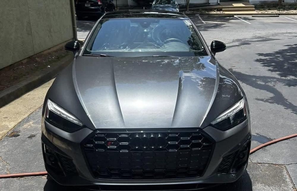Grey Audi S5 after a full exterior detail in an apartment parking lot